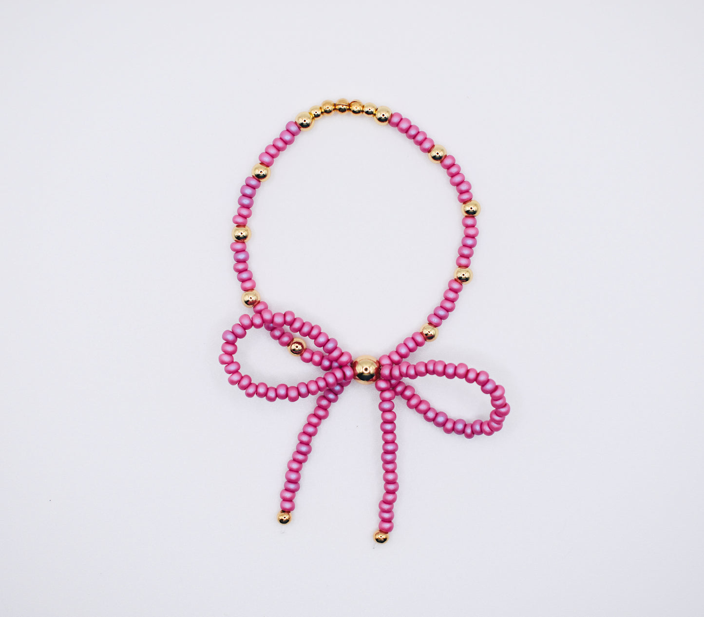 Fuchsia & gold bow bracelet