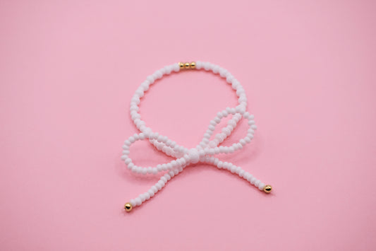 White & gold bow bracelet